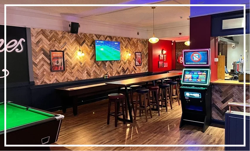 Group 8 (11) Bar interior with pool table and screens.