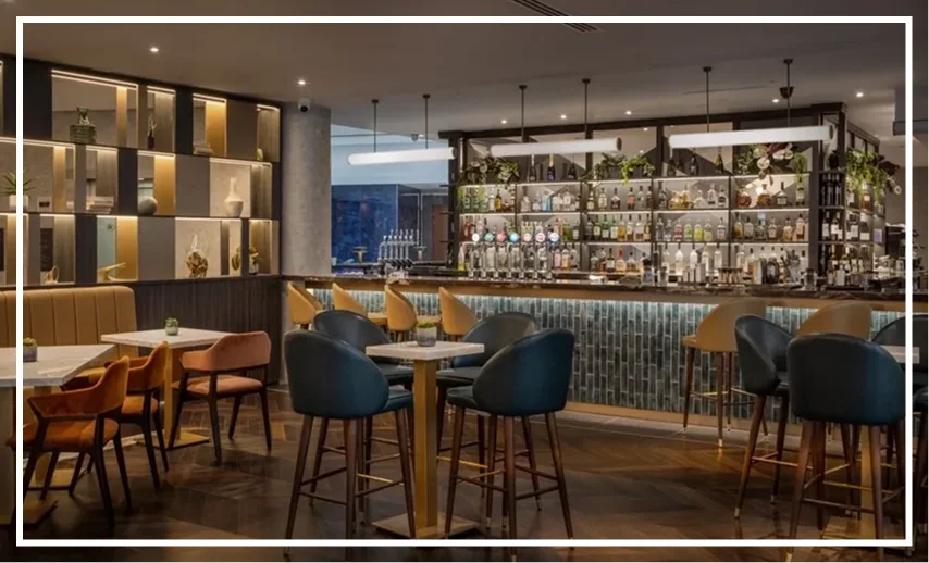 Group 8 (7) Modern bar with stylish seating and decor.