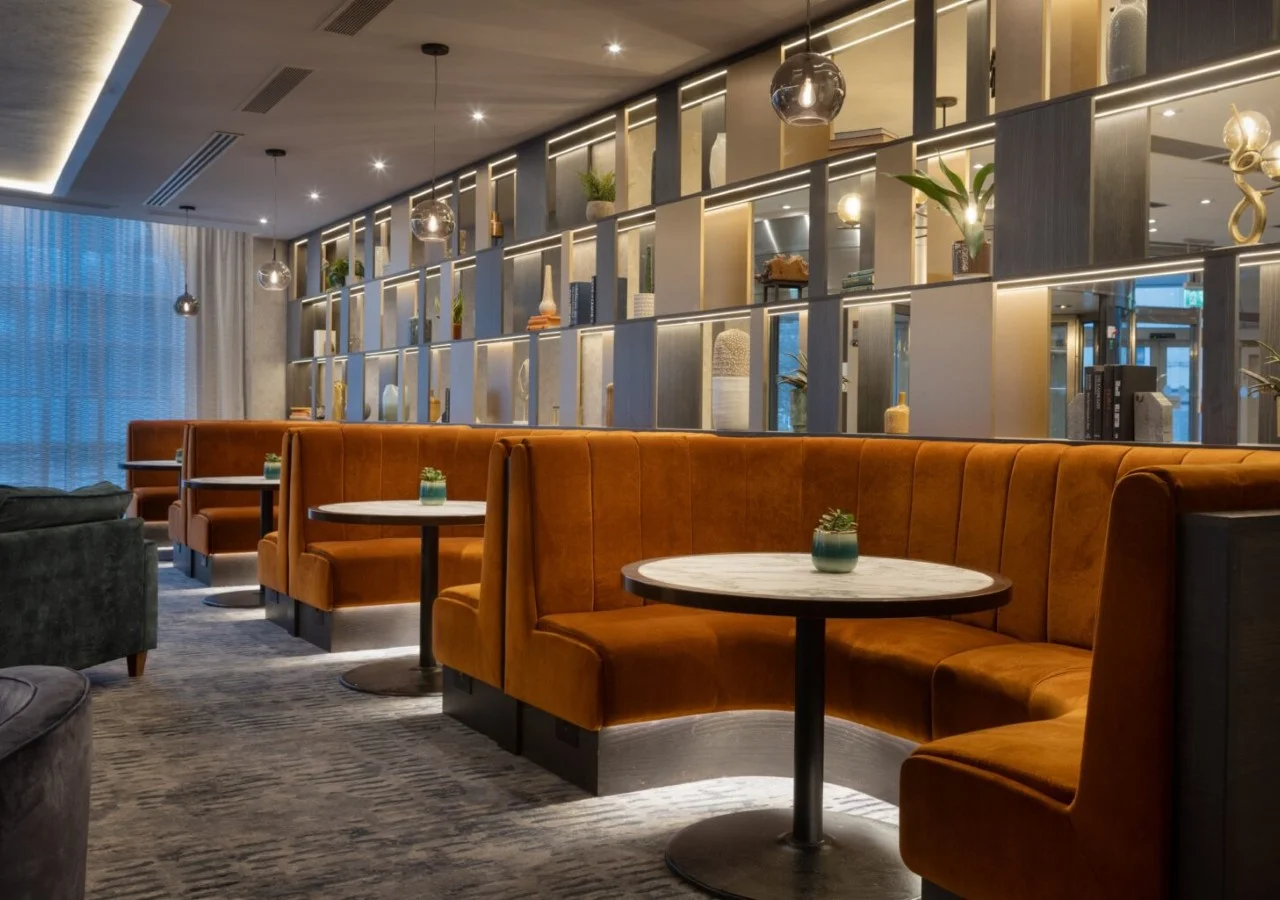 Modern restaurant interior with cozy seating booths.