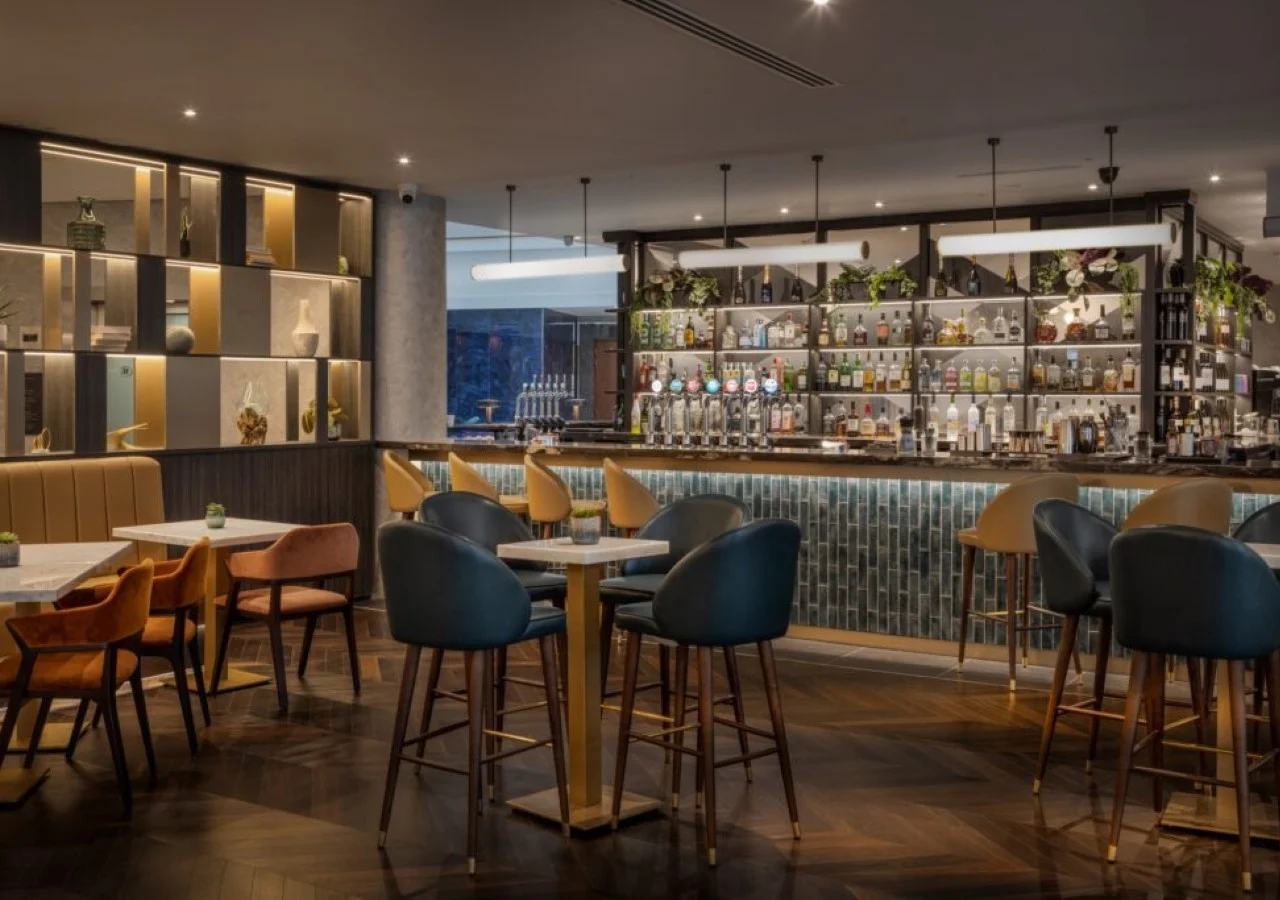 Modern bar interior with stylish seating arrangement.