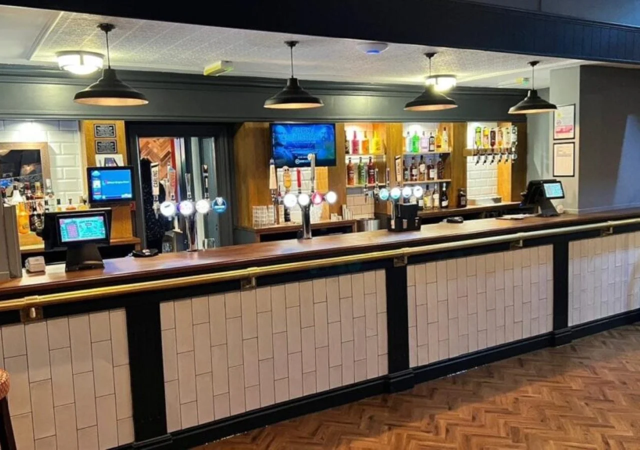 Modern bar counter with drink dispensers.